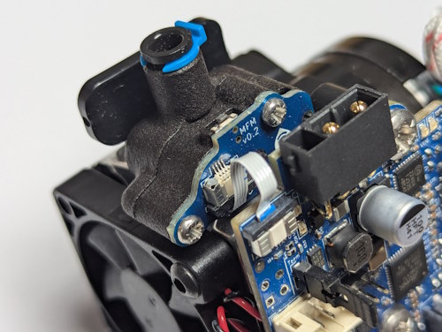 The Duet3 Roto filament monitor mounted in the E3D Revo Roto extruder, showing the Duet3 Roto Toolboard on the front of the extruder and the FFC connection between the filament monitor and the toolboard.